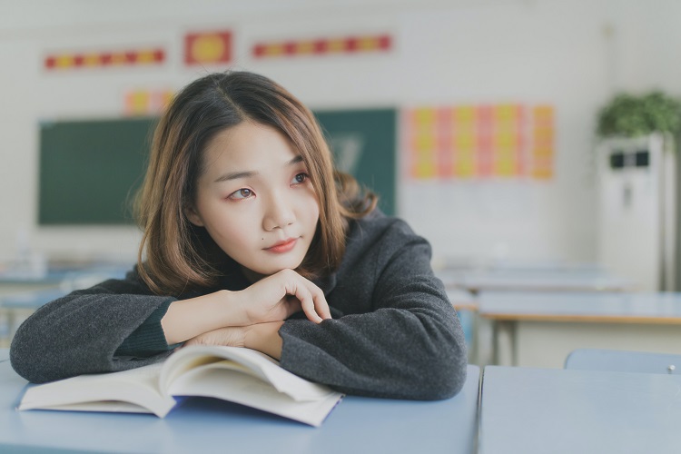 female asian student classroom unsplash