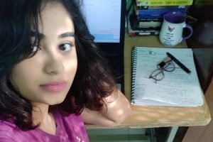 Mahevash Shaikh looking content at her writing desk